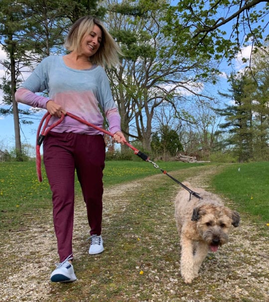 Kirsten wears the Allbirds Tree Dasher to walk her Wheaten Terrier, Harley